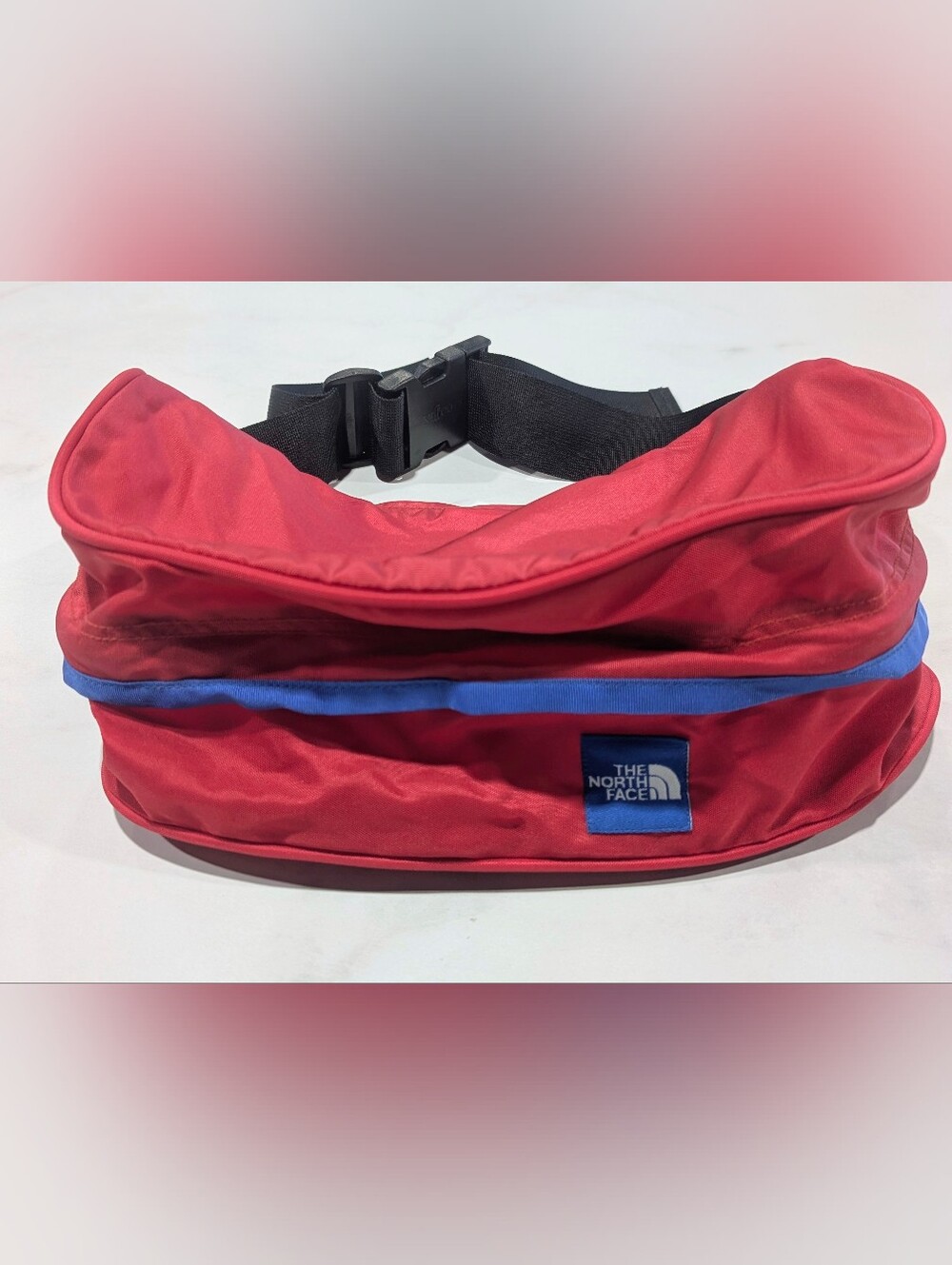 The North Face Red Lumbar Pack with Blue Trim